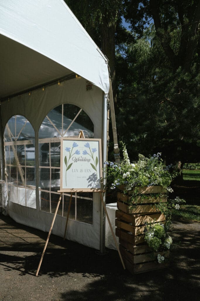 Elevated backyard wedding welcome sign