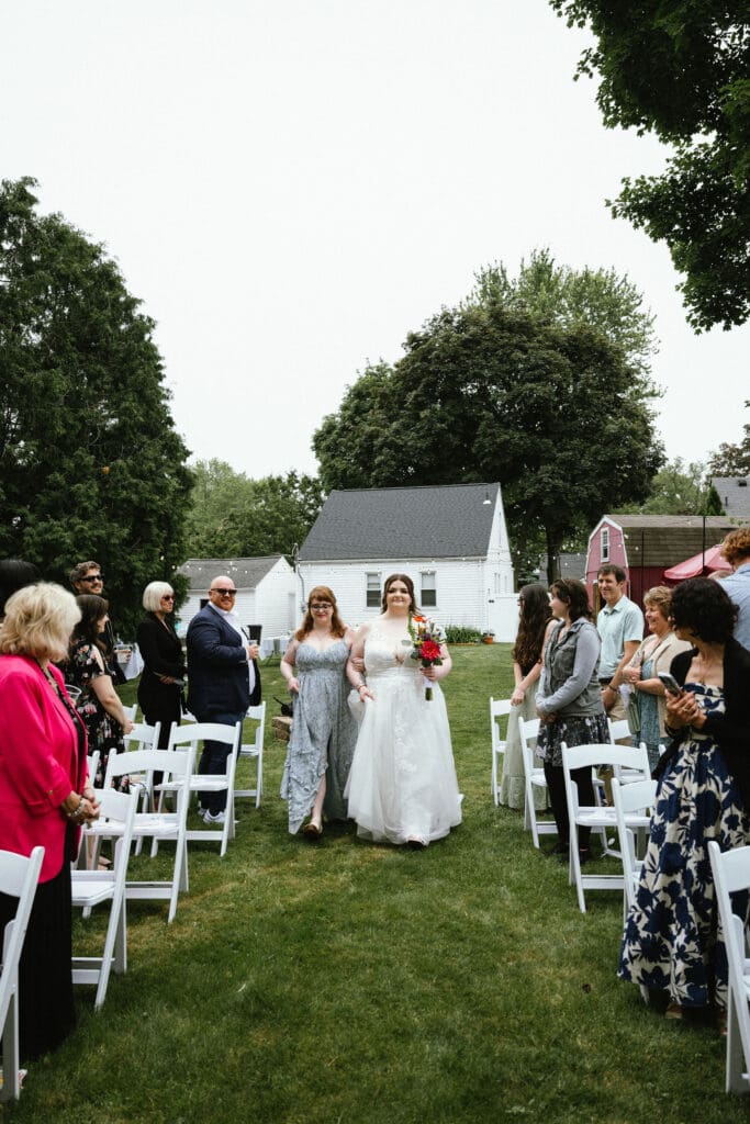 Bride coming down the aisle at a backyard wedding ceremony in Metro Detroit