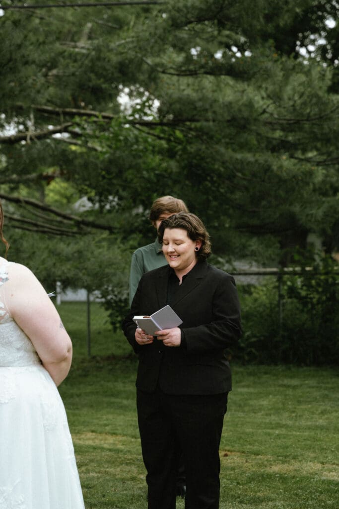 Sharing vows at a backyard wedding ceremony in Michigan