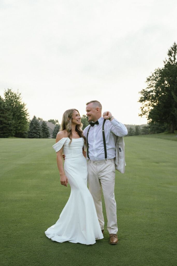 How to feel comfortable in front of the camera: Photo of a couple getting married at Pine Knob Carriage House