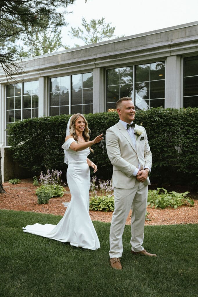 How to feel comfortable in front of the camera: Photo of first look during a wedding day