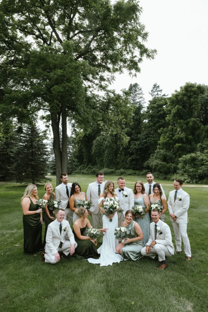 How to feel comfortable in front of the camera: Photo of couple and their wedding party having fun